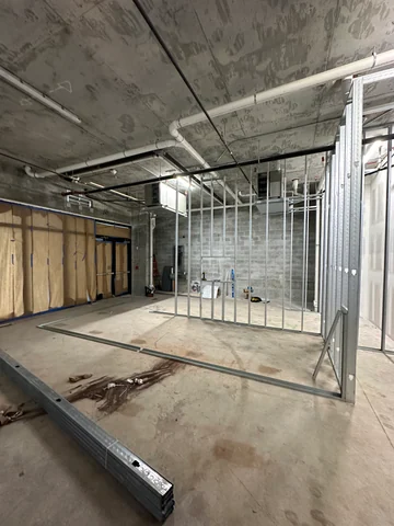 Metal framing defining the interior rooms at Craft, with unfinished passages and openings.